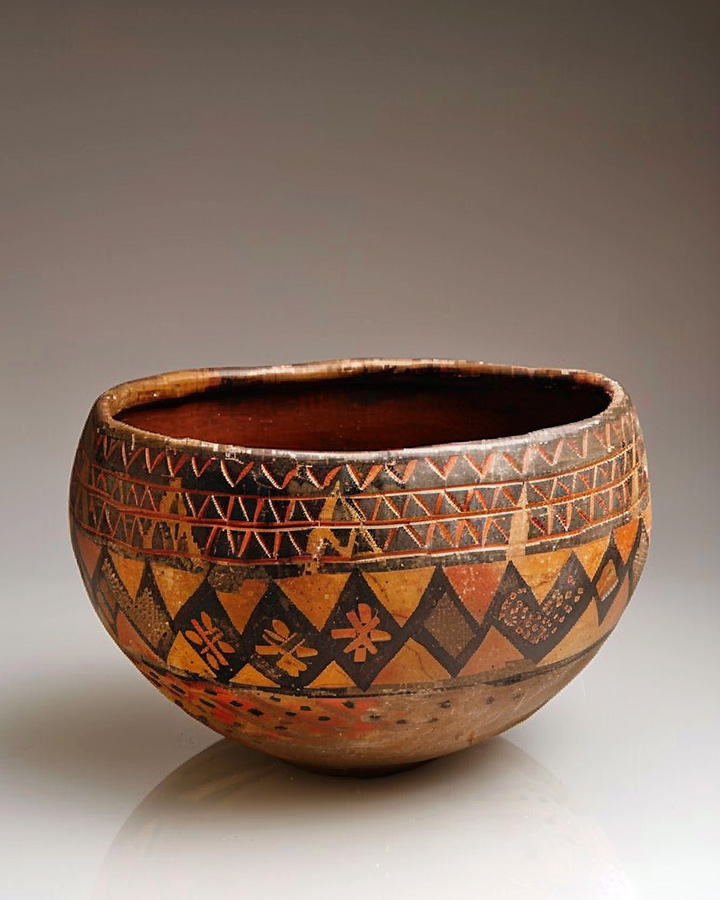 An antique ceremonial medicine bowl made from clay.